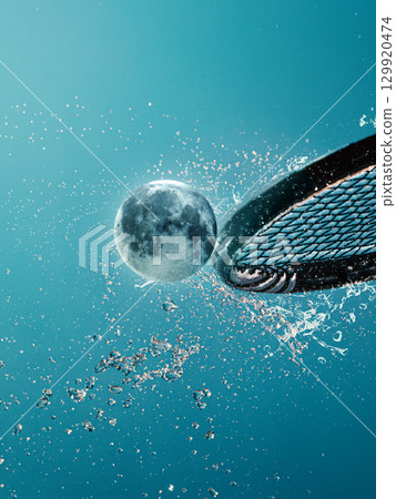 Creative collage tennis racket hitting moon ball with splash effect Creative collage tennis racket hitting moon ball with splash effect 129920474