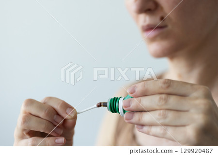 Treatment of wounds after removal of the moles with betacine Closeup. 129920487