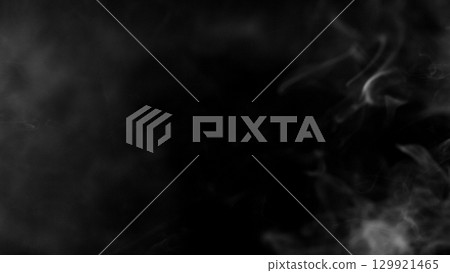 Detail Shot of Atmospheric Smoke Slowly Floating on Black Background 129921465