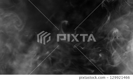 Detail Shot of Atmospheric Smoke Slowly Floating on Black Background 129921466