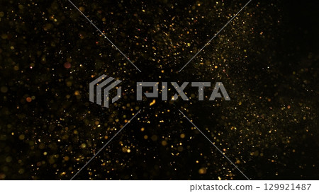 Freeze Motion Shot of Golden Glitter Background Isolated on Black Freeze Motion Shot of Golden Glitter Background Isolated on Black 129921487