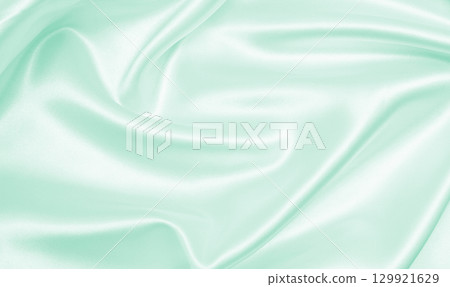 Smooth elegant green silk or satin luxury cloth texture as abstract background. Luxurious background design Smooth elegant green silk or satin luxury cloth texture as abstract background. Luxurious background design 129921629