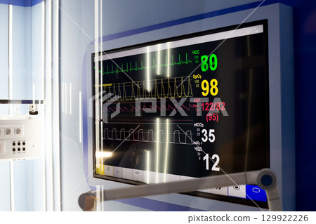 Close up of patient monitoring system showing heart rate, blood pressure and other vital signs. Ideal for healthcare, medical equipment and hospital settings in emergency or intensive care units 129922226