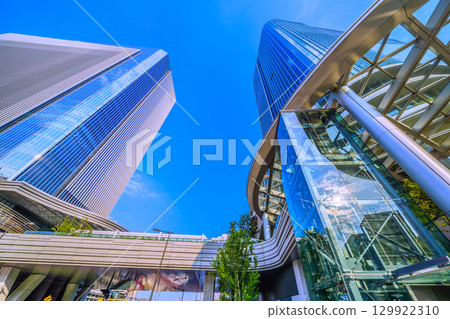 Tokyo cityscape in August. View of Takanawa Gateway City and sunlight reflected on glass... Towards a new era = 21st Tokyo cityscape in August. View of Takanawa Gateway City and sunlight reflected on glass... Towards a new era = 21st 129922310