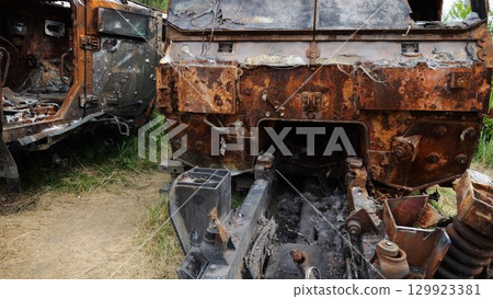 Rusty and burned-out armored vehicles on ukrainian territory. Exhibition of destroyed military equipment of the russian army. War between Ukraine and russia. Close up Slow motion 129923381