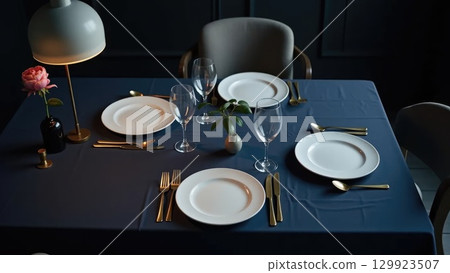Elegant Minimalist Dinner Party Table Setting Awaiting Guests Overhead Elegant Minimalist Dinner Party Table Setting Awaiting Guests Overhead 129923507