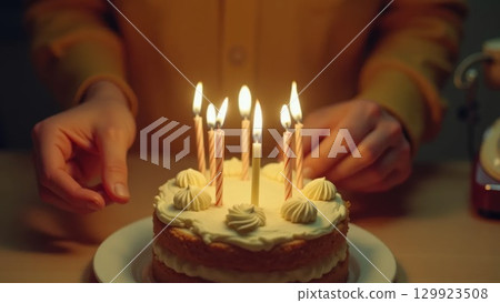 Vintage 1970s Birthday Celebration Hands Blowing Out Candles on Cake Vintage 1970s Birthday Celebration Hands Blowing Out Candles on Cake 129923508