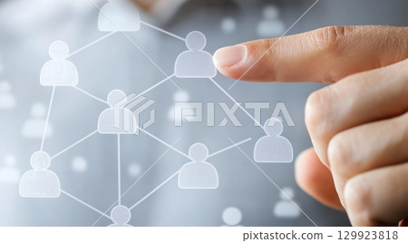 Fingers touching the network and icons of people connected Fingers touching the network and icons of people connected 129923818