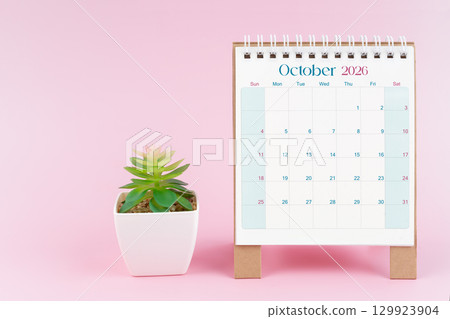 Desk calendar for October 2026 with plant pot on a pink color background. Desk calendar for October 2026 with plant pot on a pink color background. 129923904