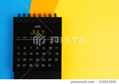 Black mini calendar for July 2026 on multi color background. 129923908