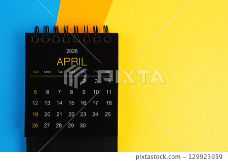 Black mini calendar for April 2026 on multi color background. Black mini calendar for April 2026 on multi color background. 129923959