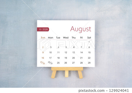 August 2026 calendar page with wooden easel, Flat lay. 129924041