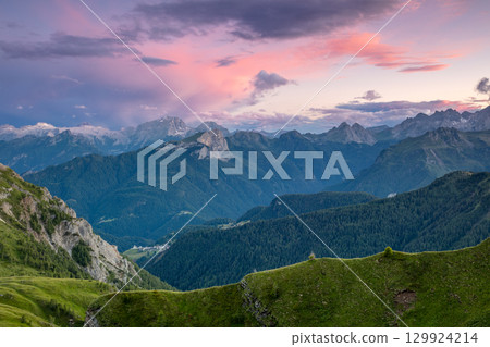 Stormy Evening Sky Over Green and Rocky Peaks Stormy Evening Sky Over Green and Rocky Peaks 129924214