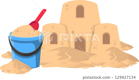 Sandcastle fantasy: A bucket, shovel, and finished sandcastle on a sandy beach vacation. 129927134