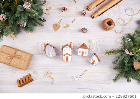 Merry Christmas greeting card. Toy wooden houses 129927601