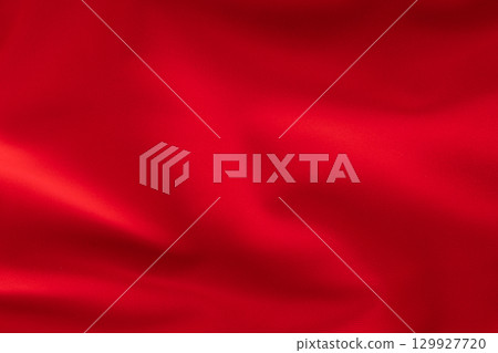 Bright red fabric with soft folds, textile texture close-up Bright red fabric with soft folds, textile texture close-up 129927720