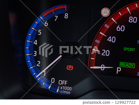 Car dashboard tachometer and speedometer close-up 129927722
