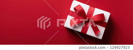 Happy Valentines day template with gift box. Romantic design decorative objects, red heart. Sale long banner, surprise poster, flyer and brochure. Mock up holiday. Front view. 3D. Panoramic Happy Valentines day template with gift box. Romantic design decorative objects, red heart. Sale long banner, surprise poster, flyer and brochure. Mock up holiday. Front view. 3D. Panoramic 129927923