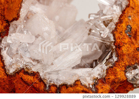 Macro mineral stone crystals Hemimorphite rock on a white background 129928889