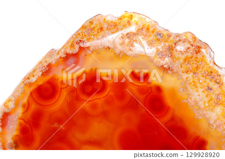 Macro mineral orange agate in crystals on white background Macro mineral orange agate in crystals on white background 129928920