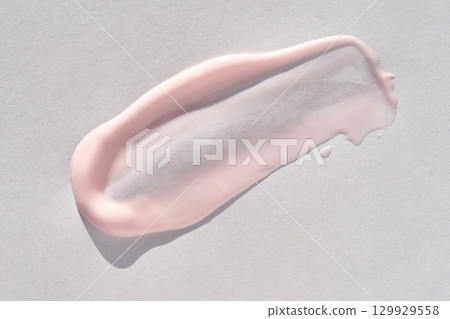 close up of pink gel texture on light background highlighting smooth and creamy 129929558