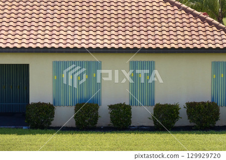 Hurricane shutters on Florida house windows. Home protection before natural disaster 129929720