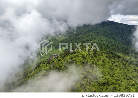 Great Smokey Mountains in summer rainy season. Mountain wooded hills in North Carolina Appalachians, USA Great Smokey Mountains in summer rainy season. Mountain wooded hills in North Carolina Appalachians, USA 129929751