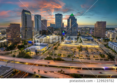 Downtown district of Tampa city in Florida, USA after sunset. Brightly illuminated highway and high buildings in modern American urban area. Downtown district of Tampa city in Florida, USA after sunset. Brightly illuminated highway and high buildings in modern American urban area. 129929782