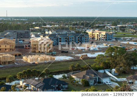 New apartment buildings under construction in North Port, Florida. Development of residential housing in US suburbs. Real estate market in the USA New apartment buildings under construction in North Port, Florida. Development of residential housing in US suburbs. Real estate market in the USA 129929797