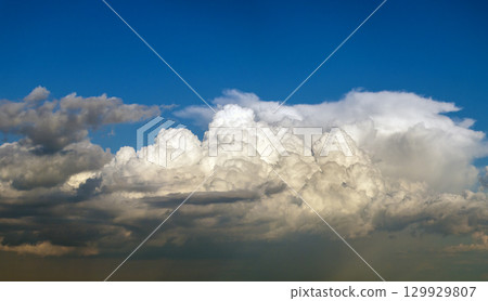 Blue sky with white clouds. Bright summer skyscape 129929807
