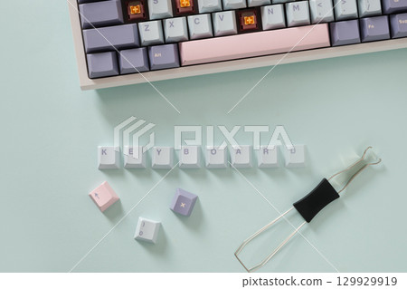 Concept cleaning and customization keycaps in modern mechanical keyboard on blue background. Custom build keyboard keycap. View from above, Concept cleaning and customization keycaps in modern mechanical keyboard on blue background. Custom build keyboard keycap. View from above, 129929919