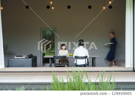 Family dining in a modern living/dining room 129930005