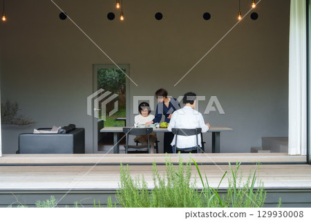 Family dining in a modern living/dining room 129930008
