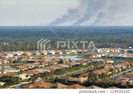 Suburban neighborhood in Florida suffering from bad air quality polluted with prescribed forest fire smoke Suburban neighborhood in Florida suffering from bad air quality polluted with prescribed forest fire smoke 129930185