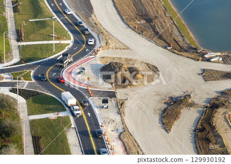 Industrial roadworks. Roundabout on wide American highway under construction. Development of transportation system for rapid transit 129930192