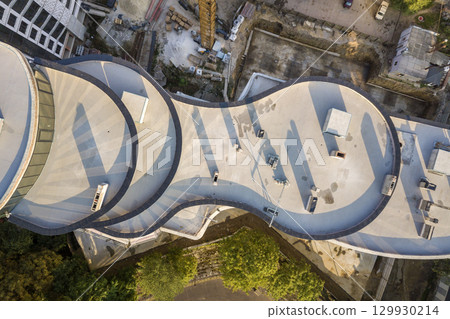 Top aerial view of a skyscraper under construction. Top aerial view of a skyscraper under construction. 129930214