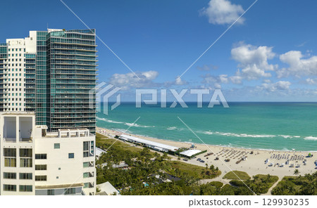 View from above of american southern seashore of Miami Beach city. South Beach high luxurious hotels and apartment buildings. Tourist infrastructure in southern Florida, USA View from above of american southern seashore of Miami Beach city. South Beach high luxurious hotels and apartment buildings. Tourist infrastructure in southern Florida, USA 129930235