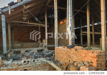 Old ruined building after earthquake. A collapsed brick house . 129930284