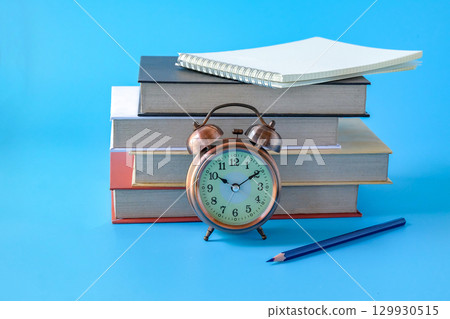 Alarm clock with books.back to school concepts. 129930515
