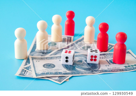 Dice game on bank note and wood toy.bets and risk. 129930549