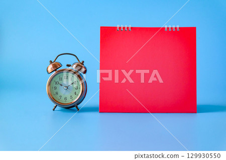 Alarm clock with bank red calender.back to school concepts. 129930550