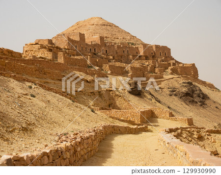 Ksar Guermessa located under the peak of Ras Oum Moutmana, Tunisia Ksar Guermessa located under the peak of Ras Oum Moutmana, Tunisia 129930990