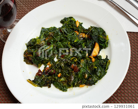 Traditional regional Spanish dish is spinach in Catalan 129931061