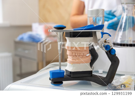 Close-up of a dental articulator with a carbon frame 129931199