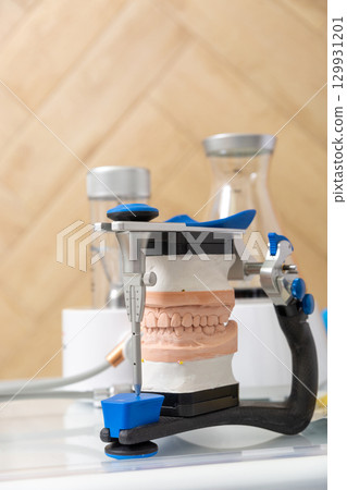 Close-up of a dental articulator with a carbon frame 129931201