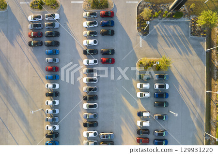 Large parking lot of local dealer with many brand new cars parked for sale. Development of american automotive industry and distribution of manufactured vehicles concept Large parking lot of local dealer with many brand new cars parked for sale. Development of american automotive industry and distribution of manufactured vehicles concept 129931220
