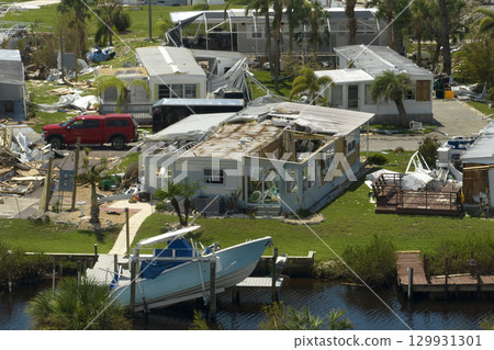 View from abover of damaged mobile homes after hurricane Ian in Florida residential area. Consequences of natural disaster 129931301