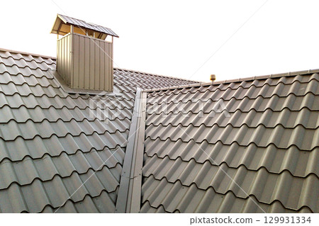 Close up of new house roof structure covered with metal tile sheets. 129931334