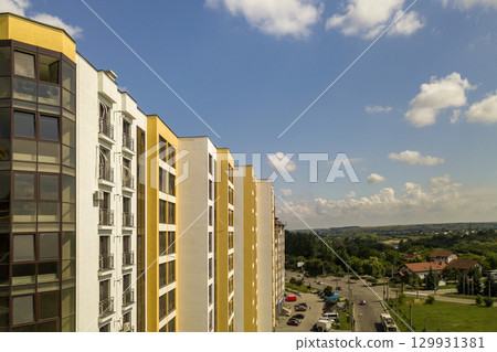 Apartment or office tall concrete building under construction. 129931381