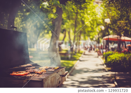 A joyful barbecue preparation in a lively and vibrant park environment full of fun A joyful barbecue preparation in a lively and vibrant park environment full of fun 129931720